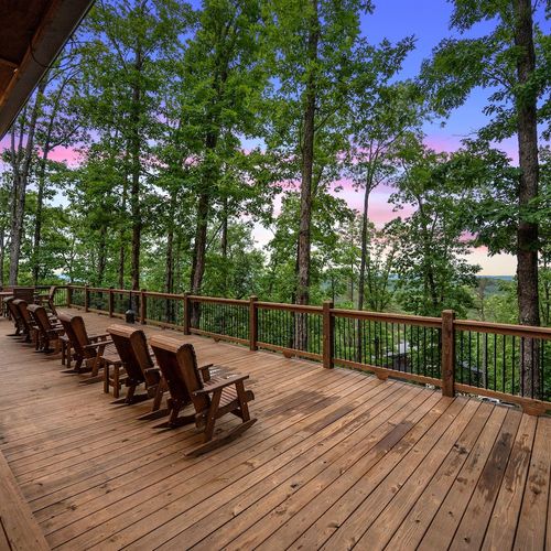 Rocking chairs and side tables on the patio.