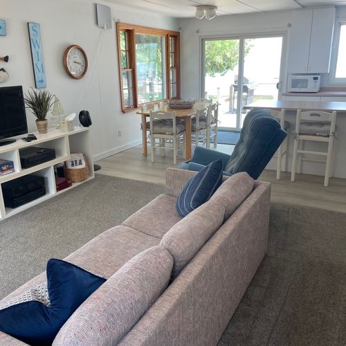 Living room:  the cottage has a very comfy and cozy living room with a sofa, loveseat, comfy chair, and television.