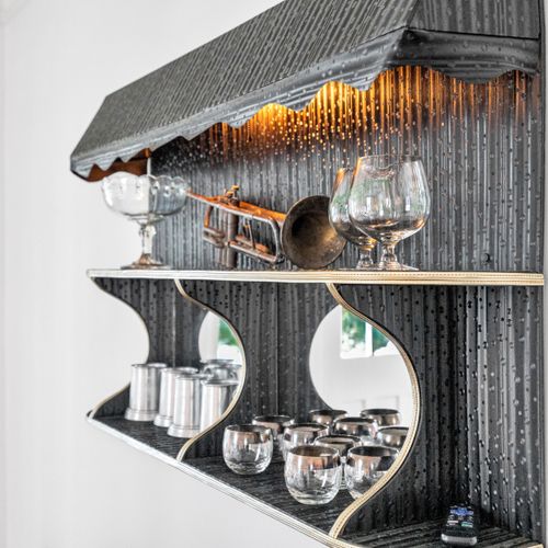 Elegant bar nook w/ wine & cocktail glasses ready for entertaining.