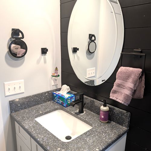 BATHROOM #1 (MAIN FLOOR):  Full bathroom on the main floor with a combination tub and shower.