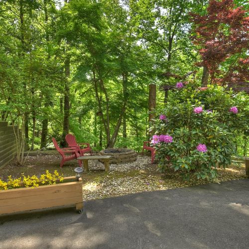 Gather around the crackling fire pit and let the warmth of the flames set the perfect mood for a relaxing evening.