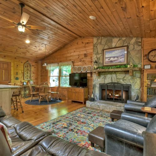 Relax in an inviting living space with plush seating and a widescreen TV, designed for your relaxation and enjoyment.