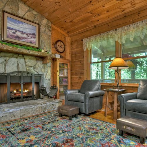 Relax in an inviting living space with plush seating and a widescreen TV, designed for your relaxation and enjoyment.