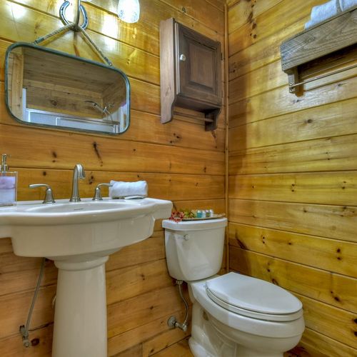 Nature's call meets rustic charm in our cabin oasis.