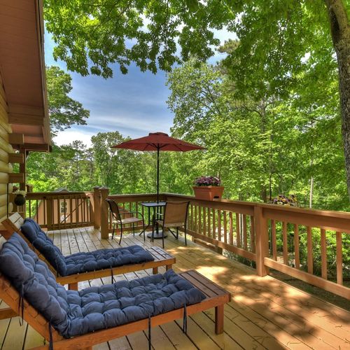 Soak and relax in the hot tub while enjoying the picturesque view.