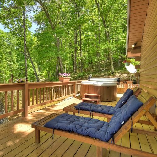 Soak and relax in the hot tub while enjoying the picturesque view.