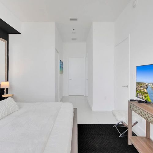 Unwind in Bedroom 1, complete with a luxurious king-size bed and a TV for your personal enjoyment.