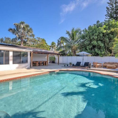 Unwind in this delightful private pool, safely enclosed by a fence to ensure your privacy while you bask in the Pompano sun.