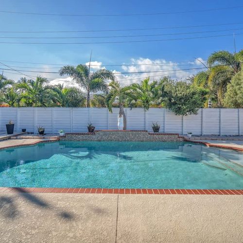 Unwind in this delightful private pool, safely enclosed by a fence to ensure your privacy while you bask in the Pompano sun.