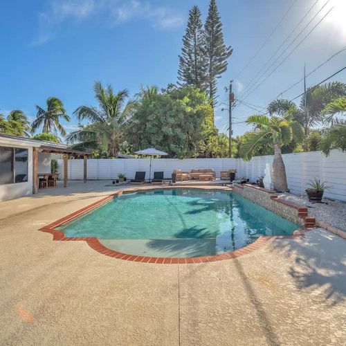 Unwind in this delightful private pool, safely enclosed by a fence to ensure your privacy while you bask in the Pompano sun.