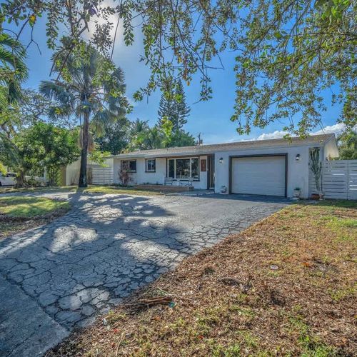 The house is nestled in a pleasant neighborhood, ideal for peaceful afternoon strolls.