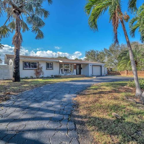 The house is nestled in a pleasant neighborhood, ideal for peaceful afternoon strolls.