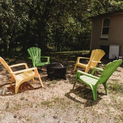Outdoor fire pit with colorful seating for relaxing evenings.