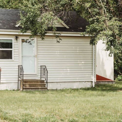 Another perspective showcasing the home’s exterior and spacious front yard.