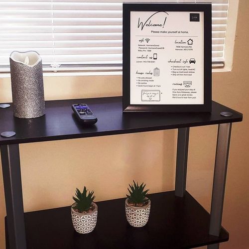 A stylish and inviting entry table with check-in details, providing a warm welcome for guests.
