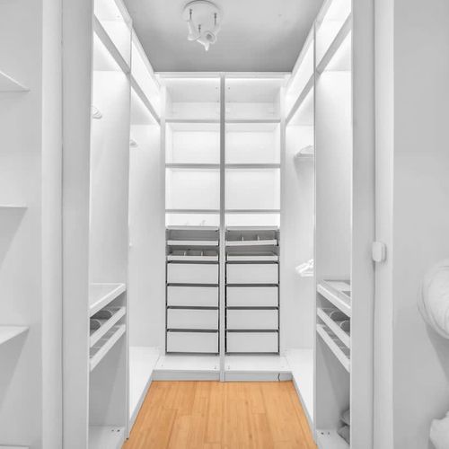 Spacious walk-in closet with ample shelving and storage. Perfect for organizing your belongings and keeping your stay clutter-free.