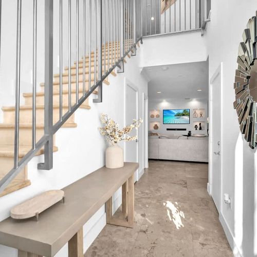 Step into a bright and welcoming entryway that sets the tone for a relaxing stay. With stylish decor and an open feel, this space invites you to unwind and explore the comfort of your home away from home.