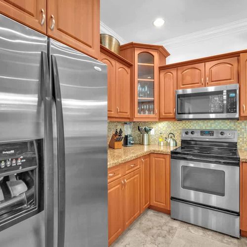Enjoy a well-equipped kitchen with modern appliances and ample space to prepare meals. A warm and inviting setting for cooking or casual dining.