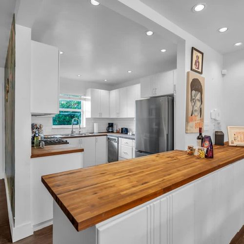 A fully equipped, open-concept kitchen that effortlessly blends style and function — the ideal space to elevate your Miami getaway.