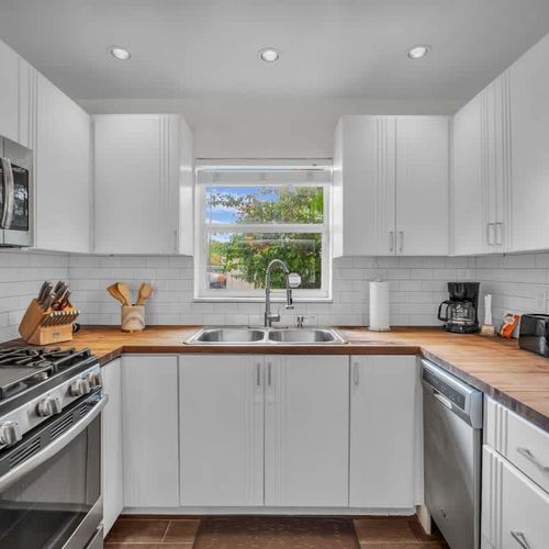 Enjoy effortless cooking in this bright, modern kitchen—fully equipped with everything you need for a seamless stay.