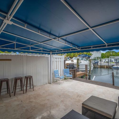 Stunning dock view with outdoor seating—perfect for a relaxing and memorable stay!