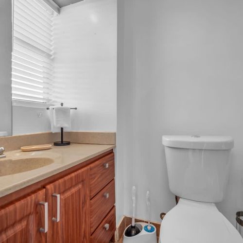Full bathroom 1 with a spacious sink and warm, inviting touches for a comfortable stay.