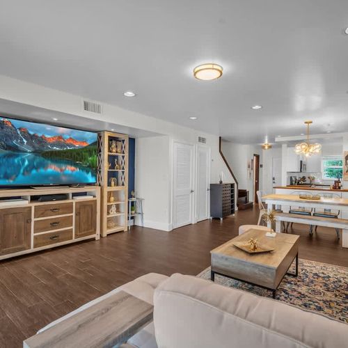 Cozy up in the living room with a large smart TV—perfect for movie nights or catching the game.