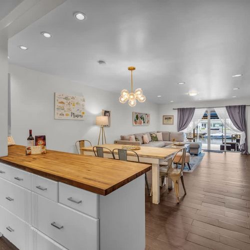 Seamlessly connect from the modern kitchen to the cozy living area and out to the breezy patio—perfect for relaxing or entertaining in true Miami style.
