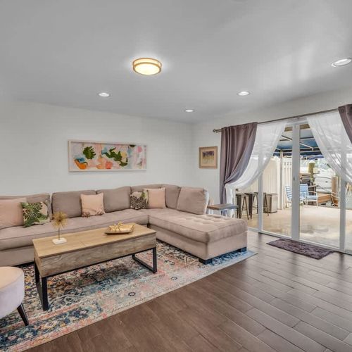 Relax in style in this chic and sun-soaked lounge, featuring cozy seating, elegant décor, and breezy access to your private outdoor space. The perfect place to unwind after a day of Miami adventures.