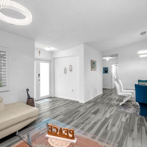 A bright and airy living space featuring stylish decor and a cozy, inviting couch.