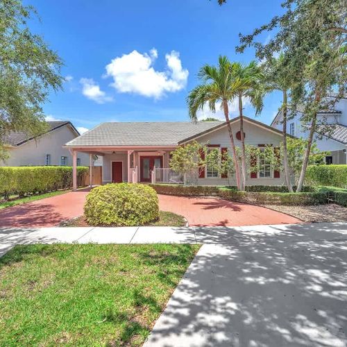 Tucked away in a peaceful neighborhood, this cozy one-story home with a wide brick driveway and vibrant greenery offers the perfect escape for a restful vacation or short staycation.