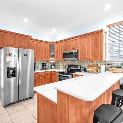 The kitchen comes ready with the basics—plenty of storage, a full-size fridge, and everything you need to whip up a home-cooked meal.