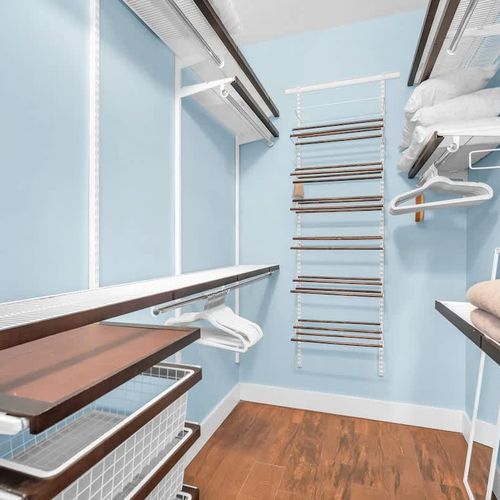 Generously sized closet space, with hangers, additional linens, pillows, and an iron. Everything you need for your convenience.