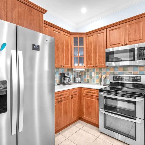 The kitchen comes ready with the basics—plenty of storage, a full-size fridge, and everything you need to whip up a home-cooked meal.
