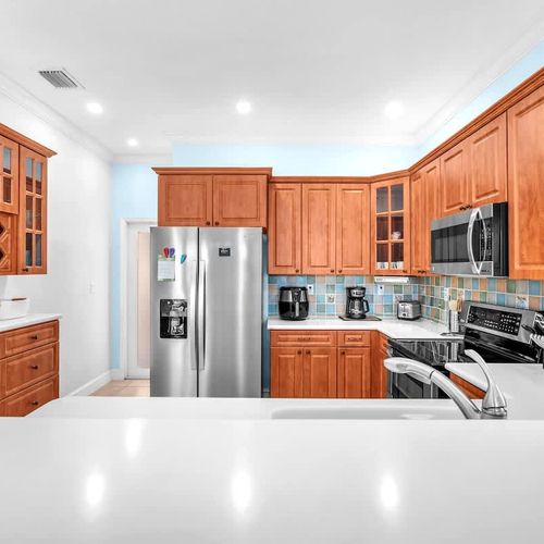 The kitchen comes ready with the basics—plenty of storage, a full-size fridge, and everything you need to whip up a home-cooked meal.