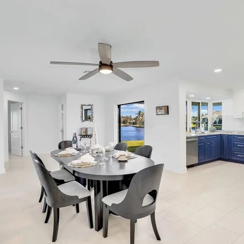 Spacious dining area with seating for five and beautiful lake views to enjoy with every meal.