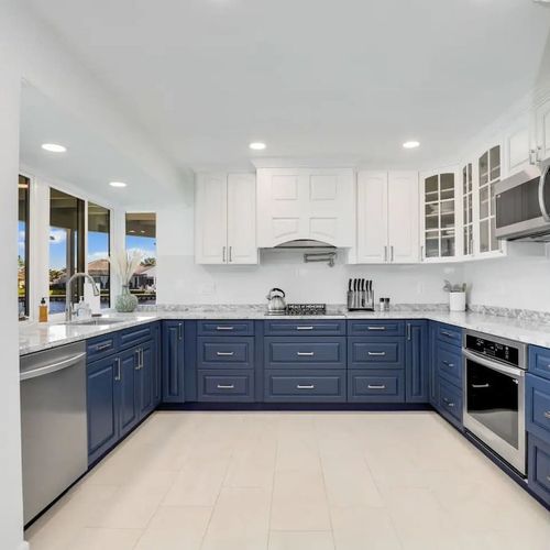 The unit features a clean, fully equipped kitchen with ample storage. Perfect for preparing meals while enjoying beautiful lake views.