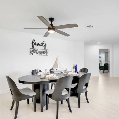 Spacious dining area with seating for five and beautiful lake views to enjoy with every meal.
