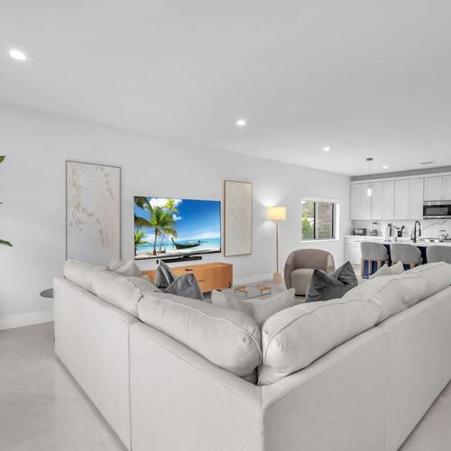 The spacious living room features a cozy sofa that converts into a pull-out bed and a widescreen TV so you can relax and enjoy your favorite shows in comfort.