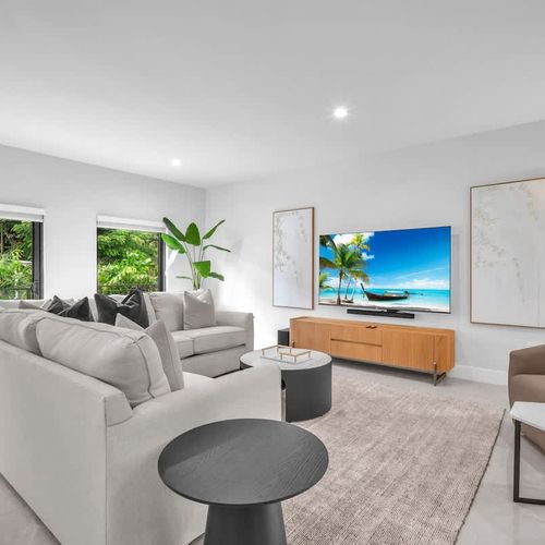 The spacious living room features a cozy sofa that converts into a pull-out bed and a widescreen TV so you can relax and enjoy your favorite shows in comfort.