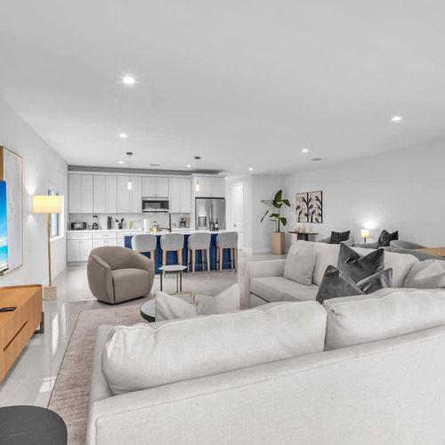 The spacious living room features a cozy sofa that converts into a pull-out bed and a widescreen TV so you can relax and enjoy your favorite shows in comfort.