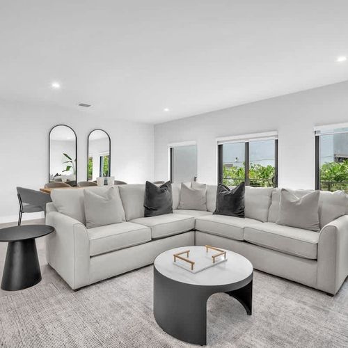 The spacious living room features a cozy sofa that converts into a pull-out bed and a widescreen TV so you can relax and enjoy your favorite shows in comfort.