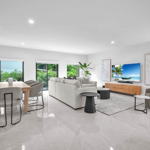 The spacious living room features a cozy sofa that converts into a pull-out bed and a widescreen TV so you can relax and enjoy your favorite shows in comfort.