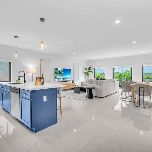 Spacious living room with a sofa bed and widescreen TV for relaxing and entertainment after a day of exploring.