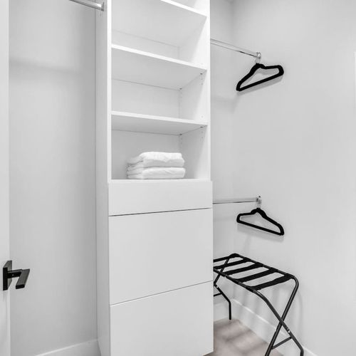 Bedroom 4 offers two cozy single beds, a private TV, generous closet space, and an ensuite bathroom—an excellent choice for kids or families needing extra room and comfort.