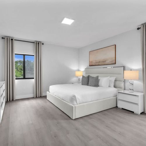 Relax in Bedroom 1 featuring a king-sized bed, ample closet space, a dressing table perfect for getting ready or working, plus your own ensuite bathroom.