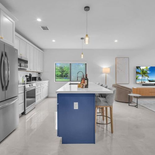 Spacious modern kitchen with a large island, plenty of storage, and all the essentials to cook your favorite meals during your stay.