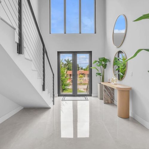 Bright and airy foyer with stylish touches to greet you and your family.