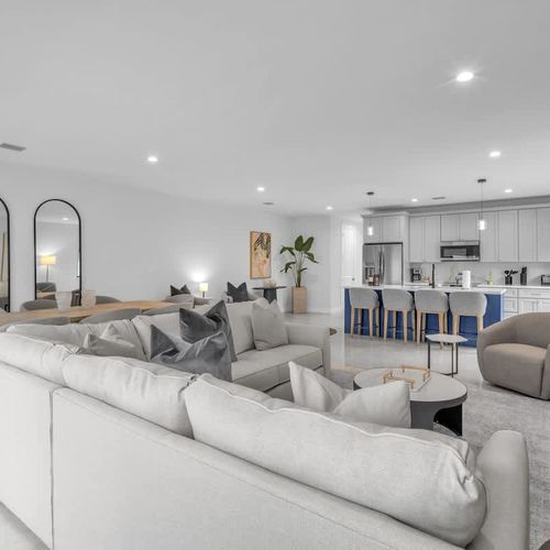 Spacious living room with a sofa bed and widescreen TV for relaxing and entertainment after a day of exploring.