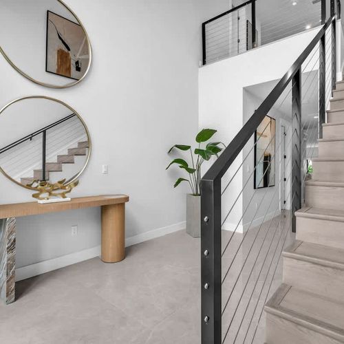 Bright and airy foyer with stylish touches to greet you and your family.